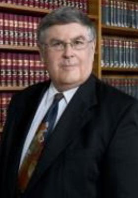 Professional lawyer from Tan And Tan Lawyers team in office setting.